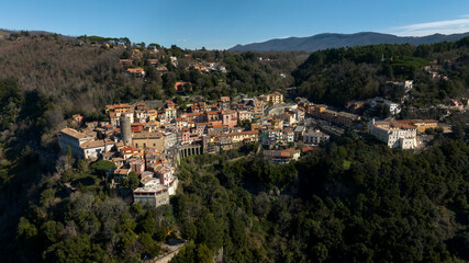 Fototapeta na wymiar Aerial view of Nemi, a town and comune in the Metropolitan City of Rome, Italy. It is located in the Alban Hills. The historic center is included in the Castelli Romani regional park.