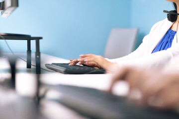 Woman's hands typing on a keyboard. Office, cowork concept.