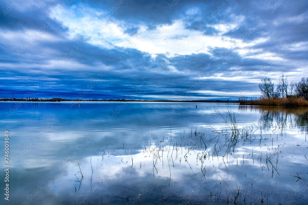 Canvas Prints Mystical clouds and light play over Lake Neusiedl in Austria