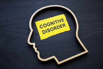 Cognitive disorder. Wooden outline of head and marking.