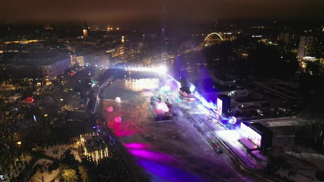 Aerial images of the inaugural event of Tartu European Capital of Culture 2024, the river is the place where the stage is placed, the robotic lights generate an impressive image.