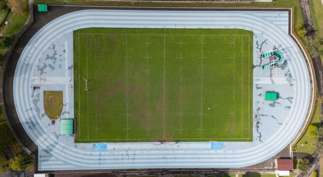 Aerial view of a sports complex with track and field