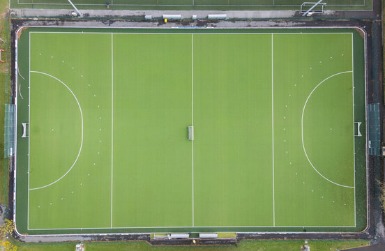 Aerial drone shot of empty green soccer fields