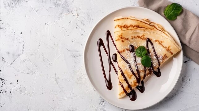 Closeup of chocolate pancakes on white plate