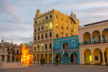 Historic buildings on Old Town Square (Plaza Vieja) in the morning in Old Havana (La Habana Vieja),...