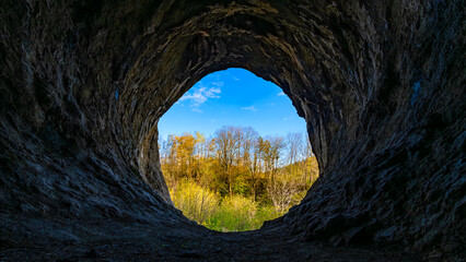 Panoramic view out of the mouth of the “Grürmannshöhle“, a big cave in Iserlohn (Sauerland,...