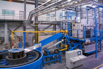 A metal roll sheet manufacturing plant with automated Machinery.