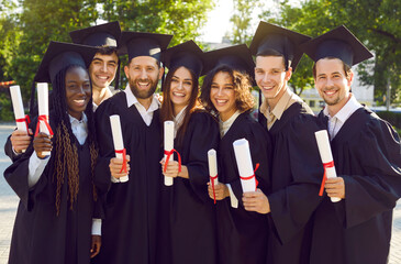 Group of happy cheerful diverse multiethnic college or university students and friends wearing...