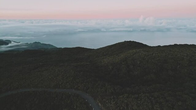 Aerial at Fanal Forest, Madeira flying towards the ocean during blue hour