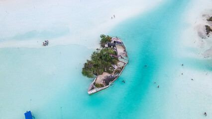 Aerial View, Beautiful turquoise water. Laguna Bacalar - the lake of seven colors. Boats, tourism...