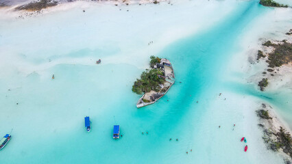 Aerial View, Beautiful turquoise water. Laguna Bacalar - the lake of seven colors. Boats, tourism...