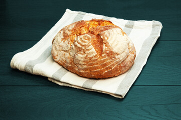 delicious Italian bread on a  turquoise background.
appetizing homemade bread on dark wooden...