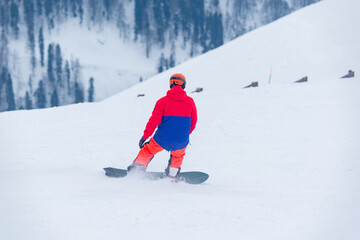 Man on the snowboard on the ski mountain resort. - 746028235