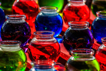glass with colored liquids 