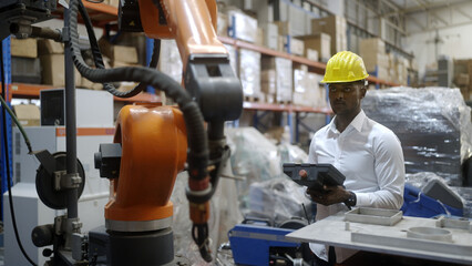 African-American mechanical arm control engineer