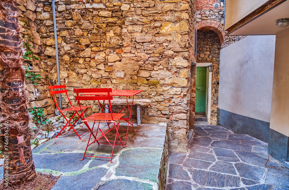 Wall mural The outdoor table with chairs on the street of Gandria, Switzerland