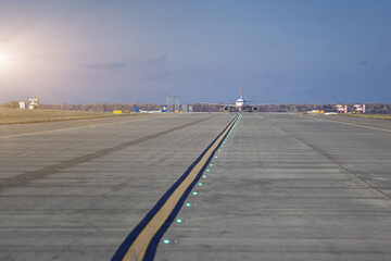 Aircraft perform taxiing on taxiway. Transportation scene.