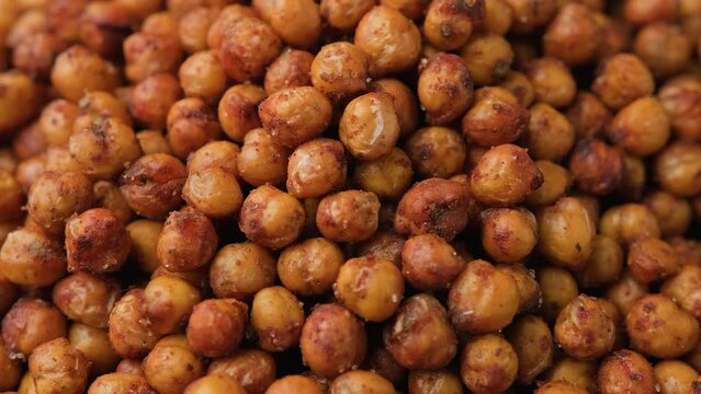 Healthy roasted chickpeas with herbs and spices. Rotating video.