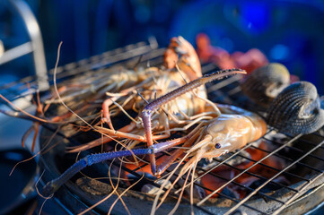 Grilled shrimp, a seafood delight on ice, with a mix of fresh crustaceans showcasing red and white hues, capturing the essence of a delicious seafood meal