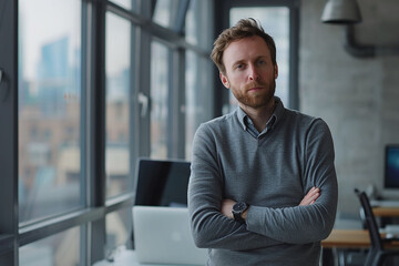 Naklejka premium Confident businessman with arms crossed standing in office. Professional portrait with city view background. Corporate business and entrepreneurship concept. Design for poster, banner