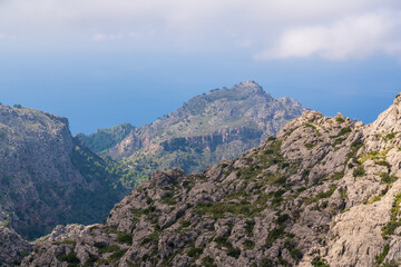 Amazing landscapes of Mallorca. Majestic mountains covered with clouds, Sunny day. Mallorca, Spain, Balearic Islands