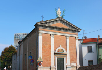 Fototapeta na wymiar Old church in downtown near San Giuliano district in Rimini, Italy