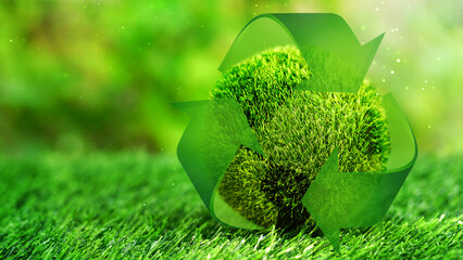 Green earth cover with the Recycle symbol on green grass field in natural background. Eliminate waste and pollution, clean and renewable energies concept, green world, eco friendly, environment day.