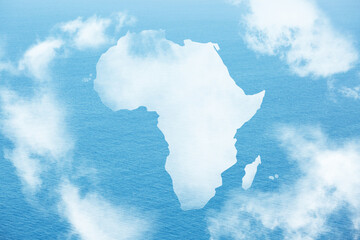 Continent of Africa map shaped clouds on blue ocean, sea background. Environment and Eco concept.