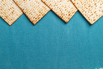 Matzah on blue background. Pesach celebration concept