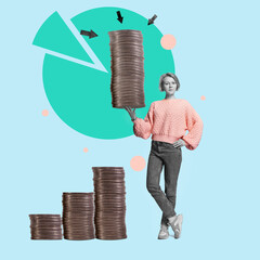 A modern casual business woman holds a large stack of crypto coins in her hand. Successful trading...