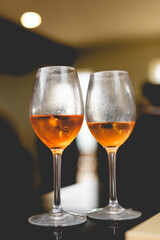 close up of an orange alcoholic beverage in a party 