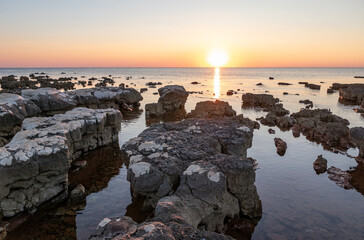 Rocks on sea in sunset