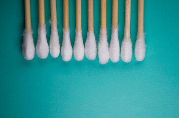 Eco natural bamboo ear sticks flat lay blue on background Sustainable lifestyle concept Zero waste plastic free items Stop pollution Reuse Reduce Recycle Refuse Eco-friendly cotton swabs Copy space