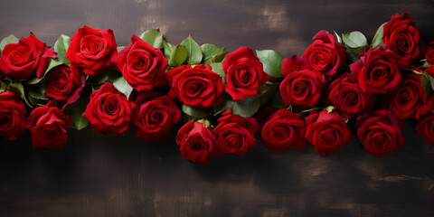 A bunch of red roses with a black background.