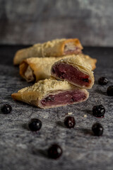 Homemade blueberry strudel gray background ready to eat