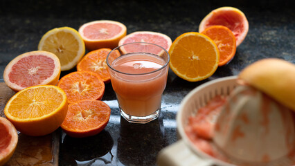 glass of orange juice and fruits