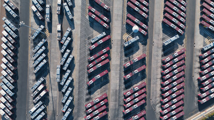 The parking lot is jam-packed with cars of various sizes and colors, neatly parked in designated spaces. The vehicles range from sedans to SUVs, indicating a bustling place with limited parking spots