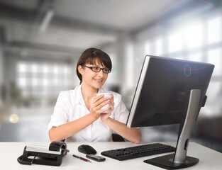 Young business woman working in office
