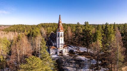 Aerial top view to Finnish Lutheran Church in Lumivaara village. Building in Neo-Gothic style in...