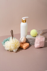 white cosmetic jar bath foam  and washcloth, soap on beige surface skin and body care