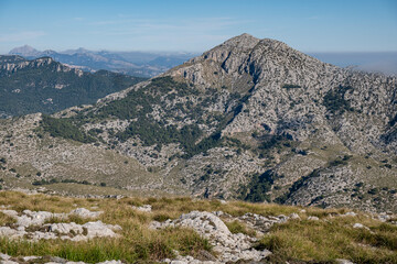 Fototapeta na wymiar hikers, puig Galatzo, Estellencs, Mallorca, Balearic Islands, Spain