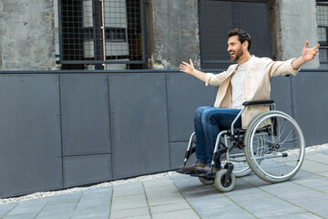 Fototapeta na wymiar Young man on a wheelchair feeling free and excited