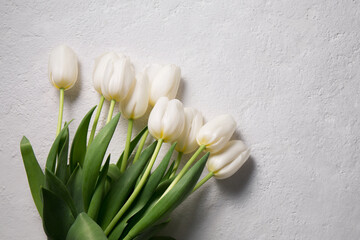 A bouquet of white tulips on a light background