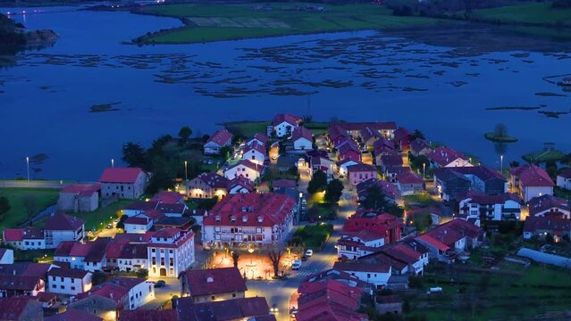 Church of Santa Cruz and town of Escalante seen from a drone in the Parque Natural de las Marismas de Santo&ntilde;a, Victoria y Joyel Natural Park. Cantabrian Sea. Escalante, Cantabria, Spain, Europe