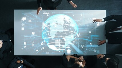 Top down aerial of business team brainstorm idea about digital communication or global network connection. Group of diverse business people discuss about data processing at meeting room. Directorate.