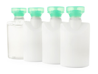 Mini bottles of cosmetic products isolated on white