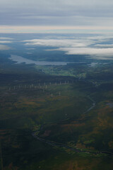 Beautiful aerial view of Norway with a Fjord and wind turbinesin the background