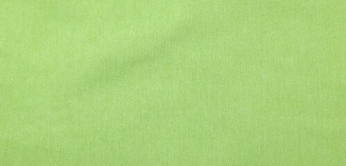 Texture of light green fabric as background, top view