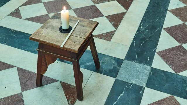 Candle on backless stool