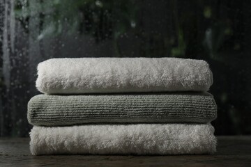 Stacked terry towels on table in bathroom